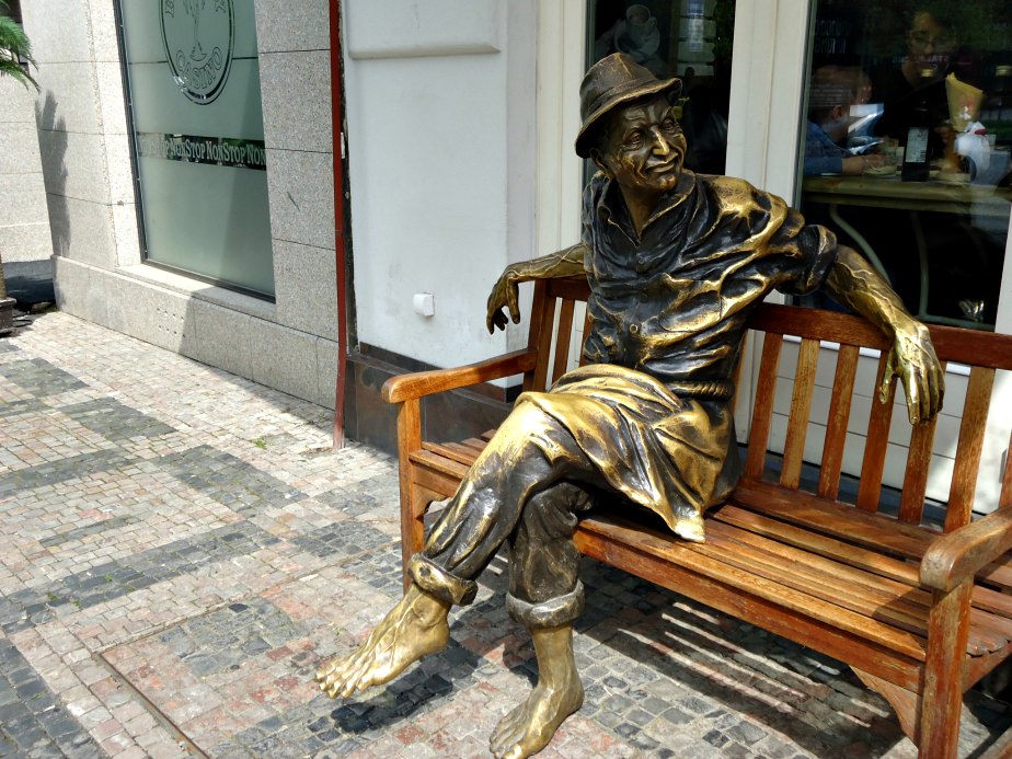 Bronze Man Sitting on a Bench in Wencelas Square Prague