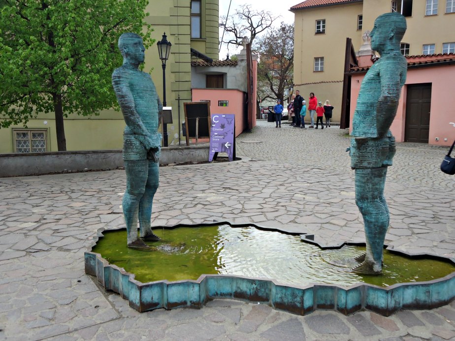 A Family looks on to "Piss" by David Cerny Prague